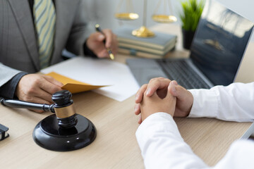 man and lawyer sitting at desk